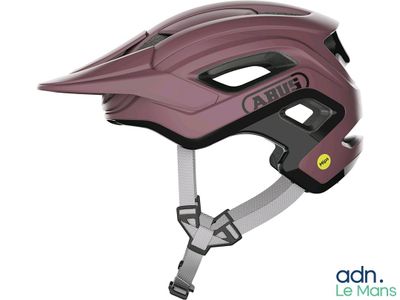 the helmet is pink and has a black vise on it