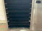 a stainless steel cabinet with a bunch of trays on it