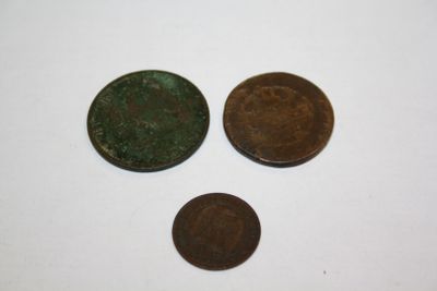 three different types of coins are shown on a white surface