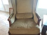 a chair that is sitting in the middle of a room