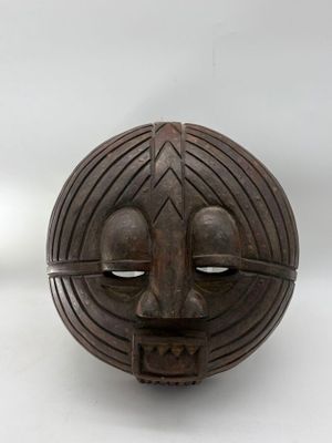 an image of a wooden mask on a white background