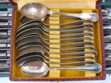 several spoons and spoon spoons are in a red case