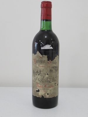 a bottle of wine that is sitting on a table