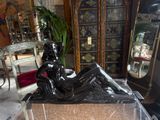 a statue of a woman sitting on a marble block