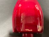 a close up of a red object on a table