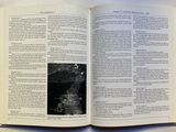 an open book with a black and white photo on it