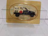 a small black car in a clear display case