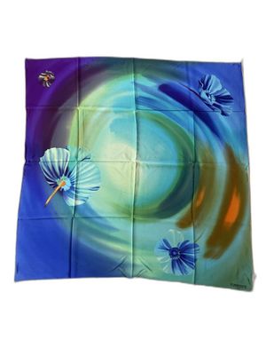 a close up of a blue and green flag with butterflies on it
