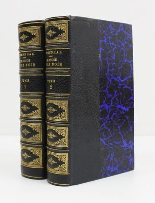 a pair of black and blue books sitting on top of each other