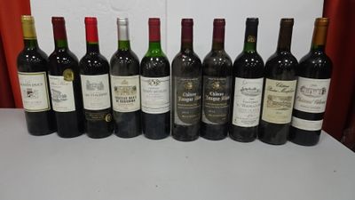 several bottles of wine are lined up in a row on a table