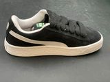 puma sued sued trainers in black and white with a white sole
