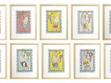 six framed pictures of children ' s drawings on a white wall