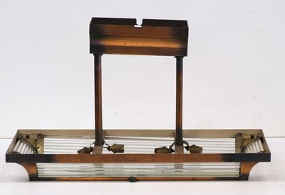 a metal and glass tray with a wooden stand