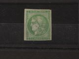 the stamp is green and has a picture of a woman on it