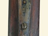 a close up of a metal door handle on a wooden door