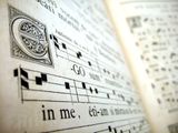 a close up of a book with music notes on it