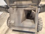 a small machine that is sitting in a garage