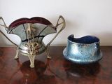 two vases that are sitting on a table