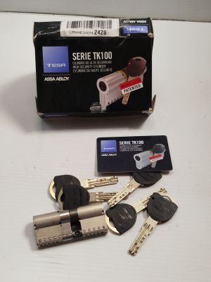 a box of keys and a credit card sitting on a table