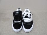 a close up of a pair of black and white shoes