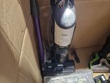 a vacuum that is sitting in a box on the floor