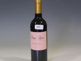 a bottle of wine that is sitting on a table