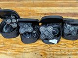 several pairs of shoes are lined up in a row on a wooden floor