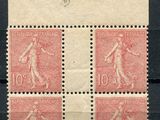a stamp with four different images of a woman on it