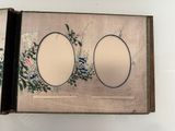 a picture of a picture of two oval mirrors on a wall