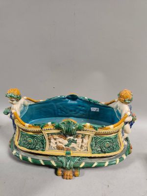 paire de figurines en céramique représentant un garçon et une fille sur un bateau