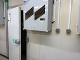an image of a room with a door and a wall mounted air conditioner