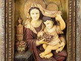 an image of a statue of a woman holding a child