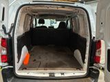 a white van with the back door open and the back of the van with the door open