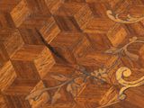 a close up of a wooden floor with a pattern on it