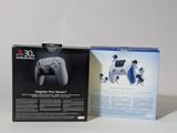 packaging for a playstation game console with a controller in the box