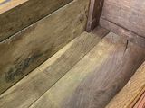 a wooden box that has been opened on the floor