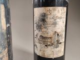 two bottles of wine sitting next to each other on a table