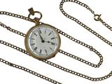 a gold pocket watch on a chain with roman numerals on it