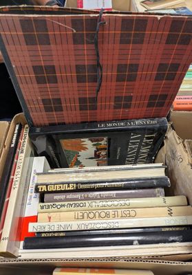 a box full of books sitting on top of a table