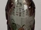 two vases with asian designs on them on a table