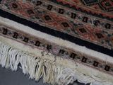 a close up of a rug with fringes on it