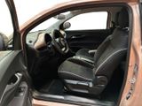 the interior of a car with the door open and the driver ' s seat up