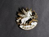 a close up of a pin with a unicorn on it