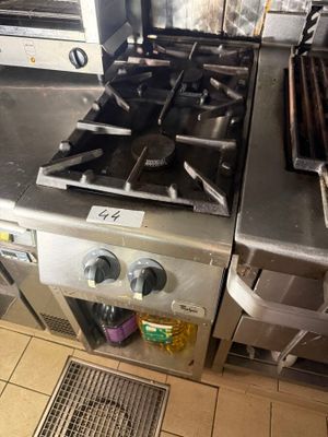 two stoves that are in a kitchen next to each other