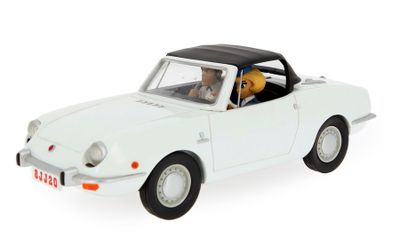 a white toy car with a dog in the back seat
