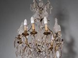 a chandelier hanging from the ceiling in a room