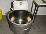an image of a large metal bowl with a scale on it