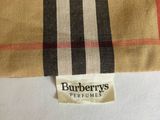 a close up of a burberry ' s shirt with a tag on it