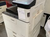 a printer sitting on top of a desk in a room