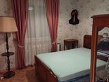 a bedroom with a bed and a dresser in it